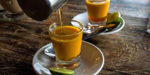 What Is the Traditional Remedy Jamu? two mugs of Jamu, a traditional Indonesian tonix for immunity