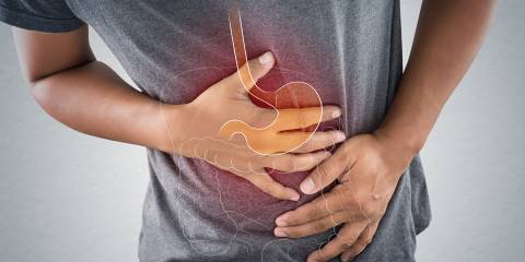 How to Improve Your Digestion a man suffering from acid reflux