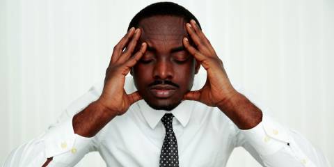 A man trying to relax and ease his mind at work