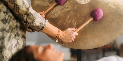 Music as Medicine a woman receiving sound therapy