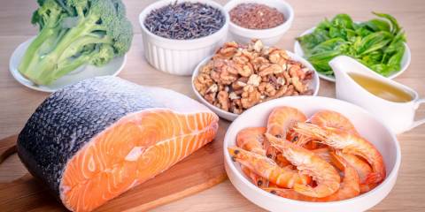 Assortment of salmon, shrimp, broccoli, nuts, and spices