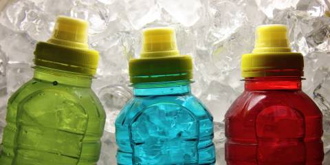 Hydration and Electrolytes sport bottles with colored liquid inside them