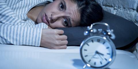 The Link Between Food and Sleep a man that fell asleep on the couch eating junk food
