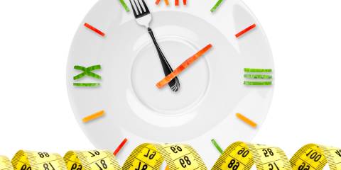 Science-Backed Ways to Speed Up Metabolism A clock made out of food and a measuring tape
