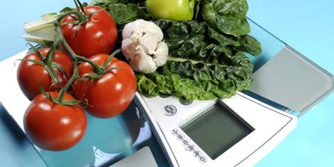 some fresh produce on a bathroom scale