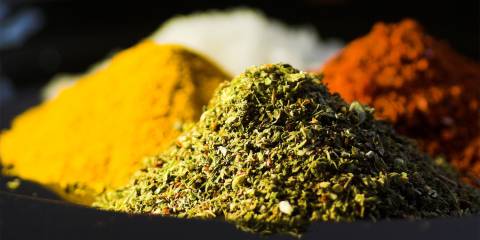 piles of fresh herbs used in ayurveda