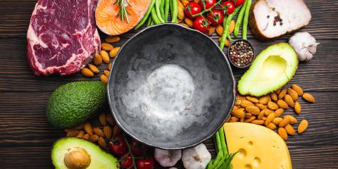 Low-Carb Diets for Health Benefits Empty rustic bowl with low carbs ingredients for clean eating and weight loss.