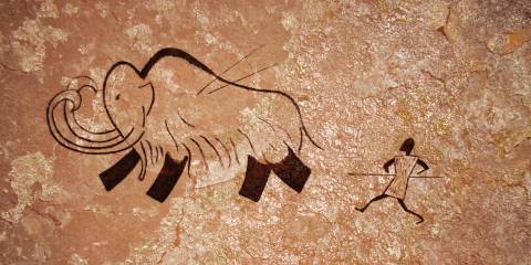 a cave drawing of hunting for food