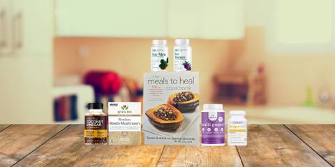 a selection of supplements and a book of anti-cancer recipes