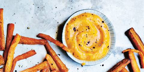 Fiery Butternut Squash Ketchup and Carrot Fries on a metal sheet pan.