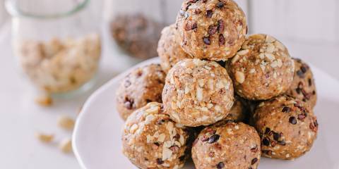 Peanut Butter Crunch Balls on a white plate.