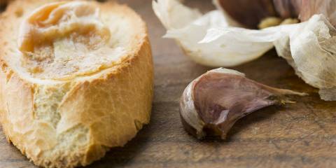 fresh baked bread and cloves of roasted garlic