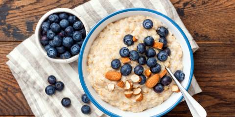 Blueberry-Almond Paleo Porridge a bowl of coconut porridge with almonds and blueberries
