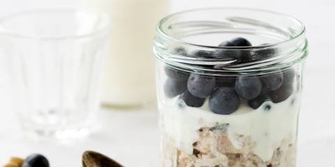 Blueberry Earl Grey Overnight Refrigerator Oats a jar of oats, blueberries, and milk