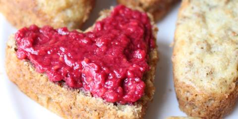 heart-shaped bran muffins with raspberry on top