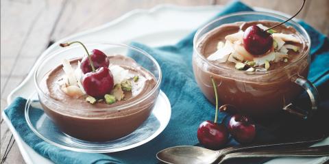 Chocolate-Avocado Mousse  Two dishes of chocolate mousse topped with cherries and pistachio