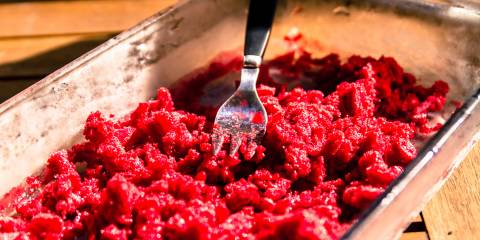 Raspberry Granita frozen raspberry being mashed and broken up