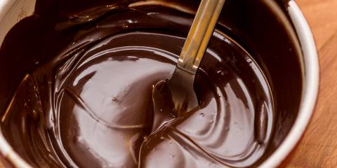 A bowl of melted chocolate.