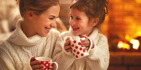 Holiday Winter Tea Blend a mother and child drinking tea by the fireplace