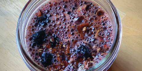 Spiced Maca Cacao Libido Vitality Tea a mason jar full of herbal tea for the libido