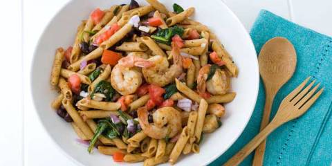 Gluten-Free Chili Lime Shrimp Pasta Salad a bowl of seasoned penne and shrimp salad