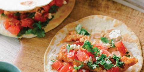 Buffalo Chicken Tacos Buffalo Chicken Tacos prepared and ready to eat on a cutting board