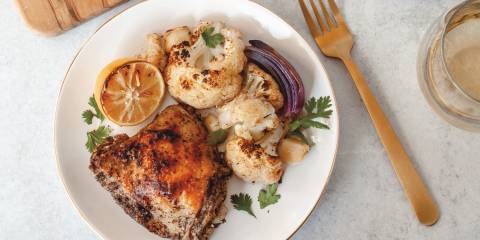 spicy chicken plated with lemon and onion