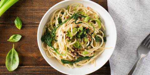 Green Pasta Puttanesca Noodles and spinach in a bowl ready to eat