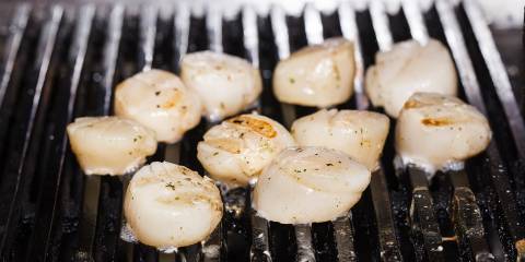 Grilled Scallops with Asparagus Salad scallops cooking on a grill