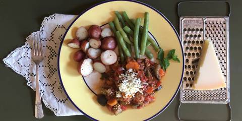 Mostly Moussaka a plate of ground turkey cooked with vegetables, with potatoes and green beans