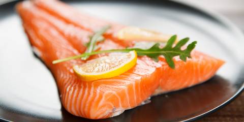 Raw salmon fish fillet on plate