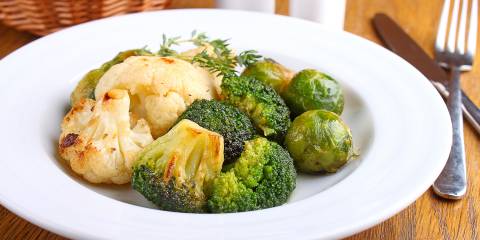 Roasted Vegetables with Miso-Lime Dressing a plate of roasted cauliflower and brussels sprouts