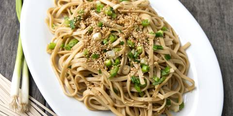 Sesame Stir Fried Udon a plate of stir-fried udon noodles with green onions
