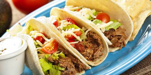 A plate of shredded beef tacos
