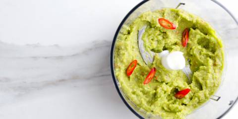 Avocado-Tomatillo Sauce in a food processor, top view.