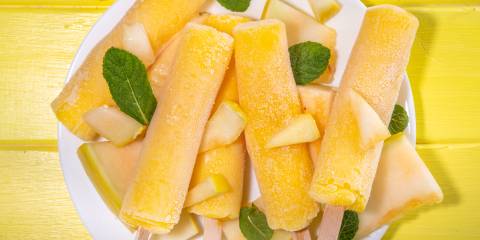 Cantaloupe Lime Frozen Pops a plate of freshly frozen cantaloupe pops