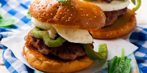 A plate of chicken sausage sliders with bell peppers and fresh basil