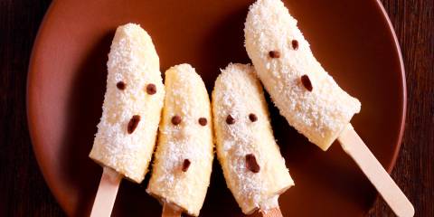 banana popsicles with coconut decorated for Halloween