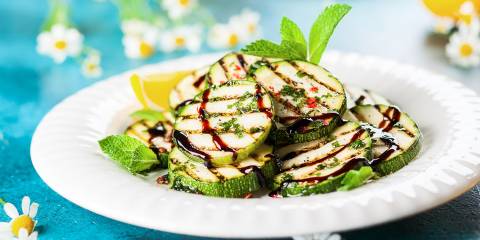 Grilled Vegetables with Balsamic Glaze a plate of grilled zucchini drizzled in balsamic