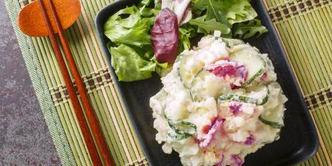 Japanese Potato Salad chopsticks and a bowl of mashed potatoes and vegetables