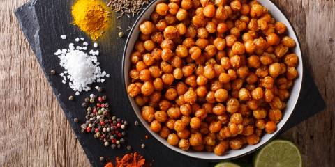 Spicy Roasted Chickpeas a bowl of roasted chickpeas and the spices used making them