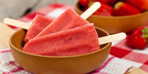 Strawberry & Blueberry Lemonade Frozen Pops a bowl of frozen strawberry pops