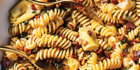 Fusilli Salad a bowl of fusilli with spinach, artichokes, and sun-dried tomatoes