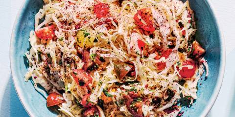 Lebanese Cabbage Salad a bowl of cabbage, cherry tomatoes, parsley, and spices