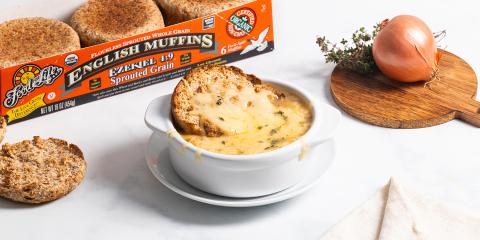 Broiled English Muffin French Onion Soup a bowl of french onion soup with a broiled english muffin dipped into it