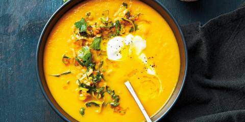 Carrot Soup with Orange-Marinated Lentils a garnished bowl of carrot soup