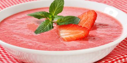 Strawberry Soup a cold bowl of creamy strawberry soup garnished with mint