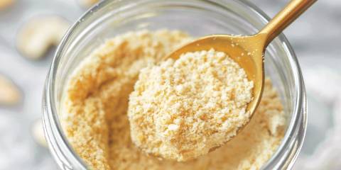 4-Ingredient Vegan Parmesan a jar of powdered vegan cheese