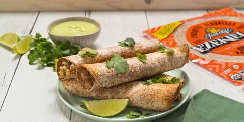 Baked Jackfruit Avocado Taquitos a plate of vegan taquitos and a package of tortillas