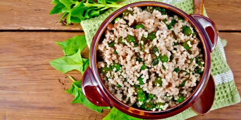 Quinoa Bowls with Avocado Dressing a bowl of quinoa and spinach